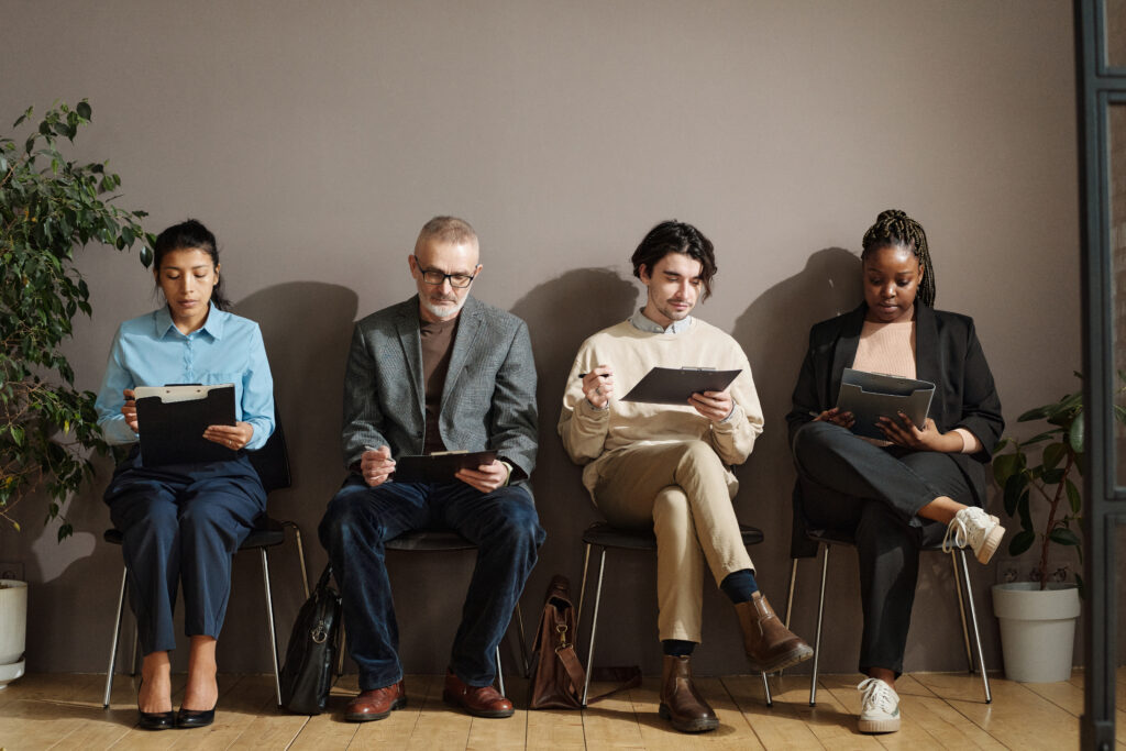 Diverse group of candidates awaiting their hiring assessments